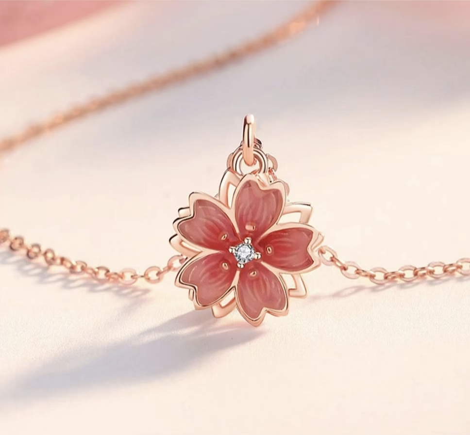 Collar giratorio de flor de durazno de plata de ley 925