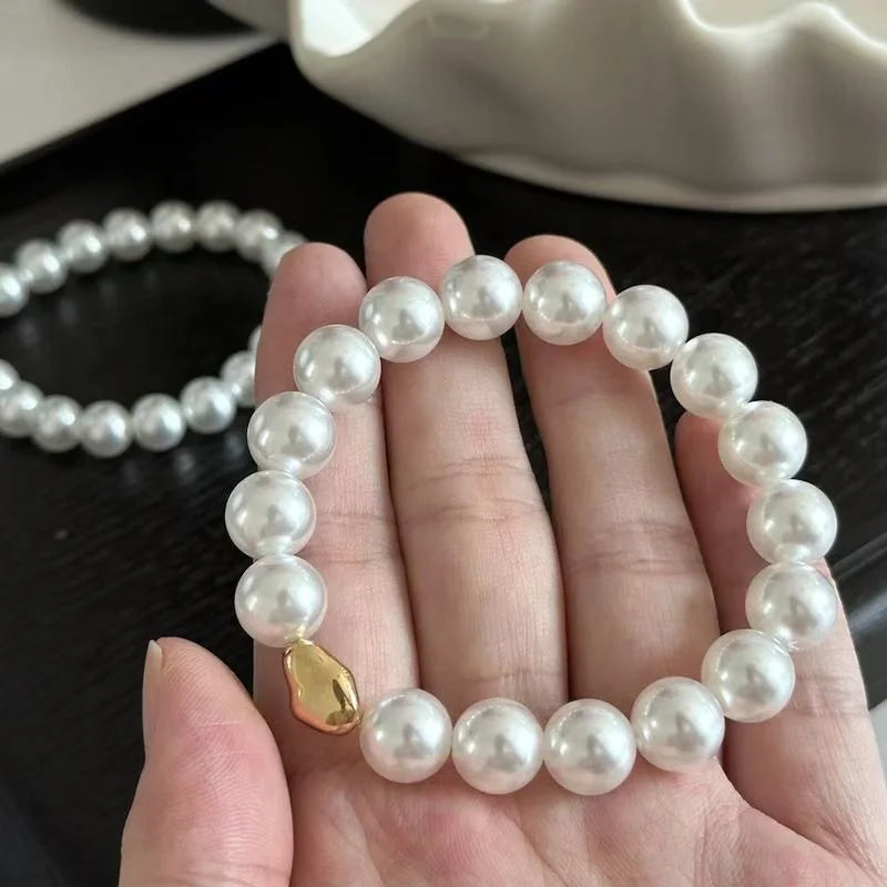 Pulsera de imitación de perlas blancas australianas de cuerda elástica