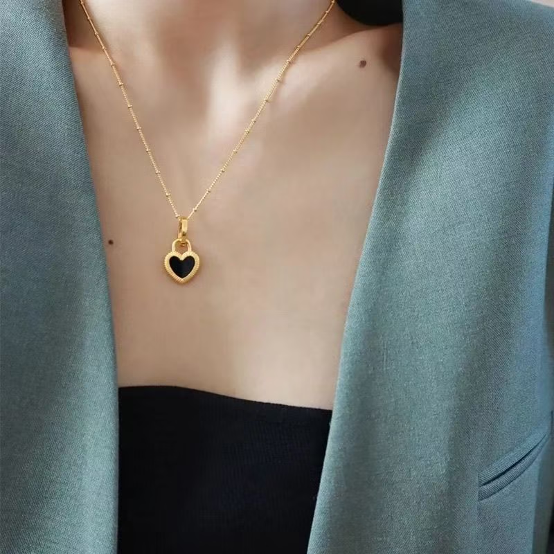 Collar de corazón de doble cara a la moda