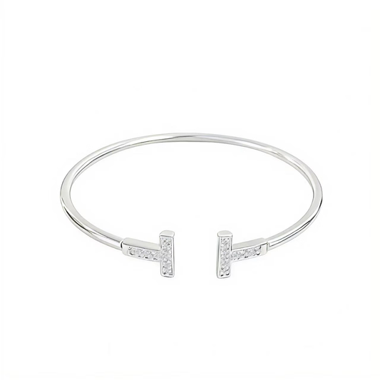 Pulsera abierta con doble T y detalles de circonia