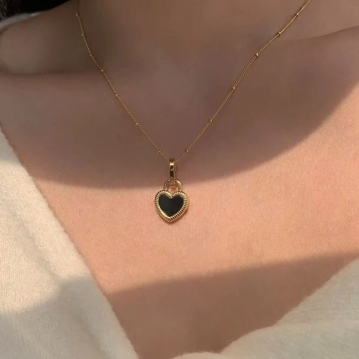 Collar de corazón de doble cara a la moda