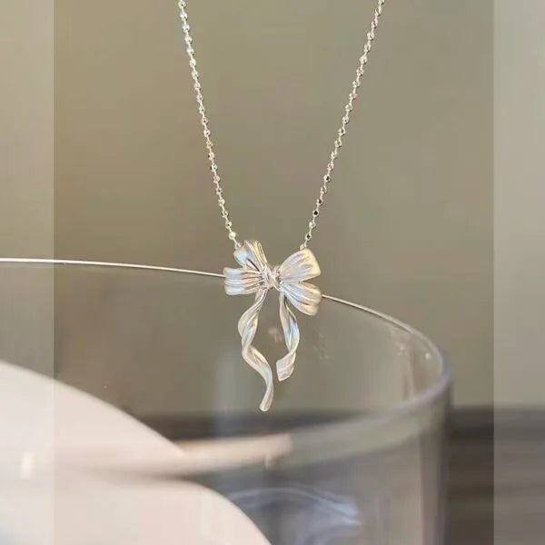 Collar doble de plata de ley 925 con lazo elegante