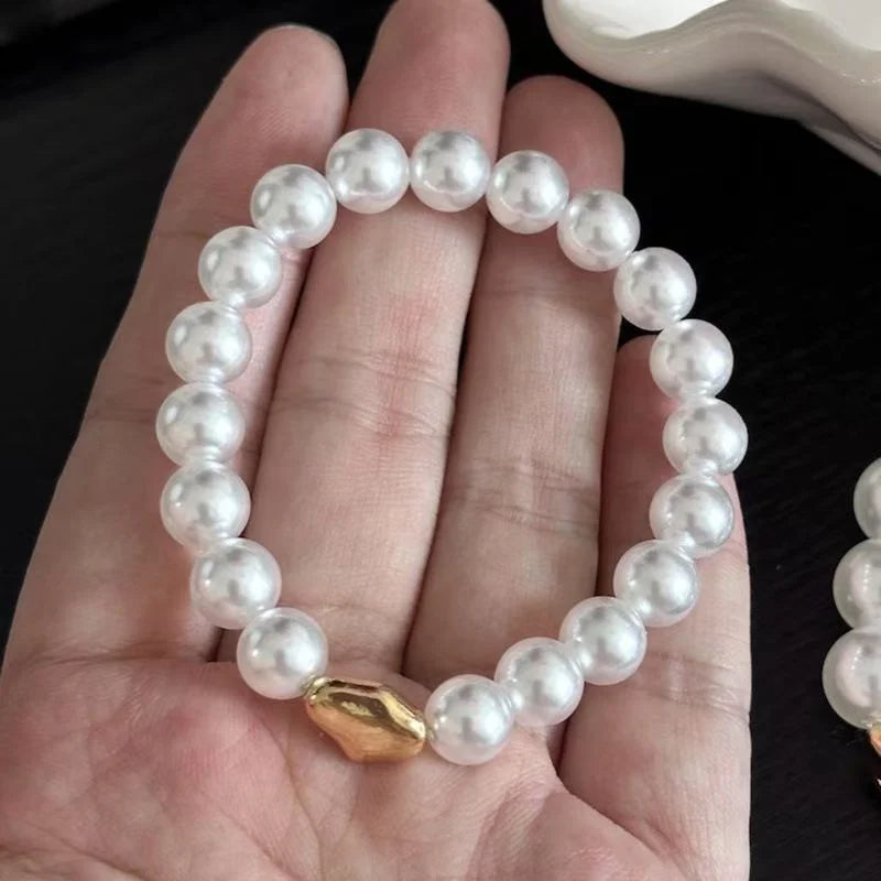 Pulsera de imitación de perlas blancas australianas de cuerda elástica