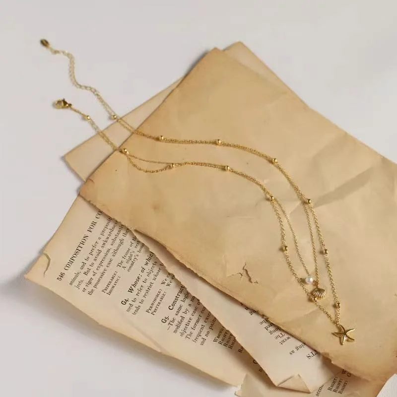 Collier empilable en or avec coquillage étoile de mer à double couche